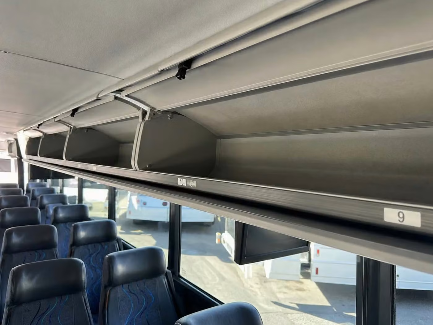 west allis 56 passenger charter bus overhead storage